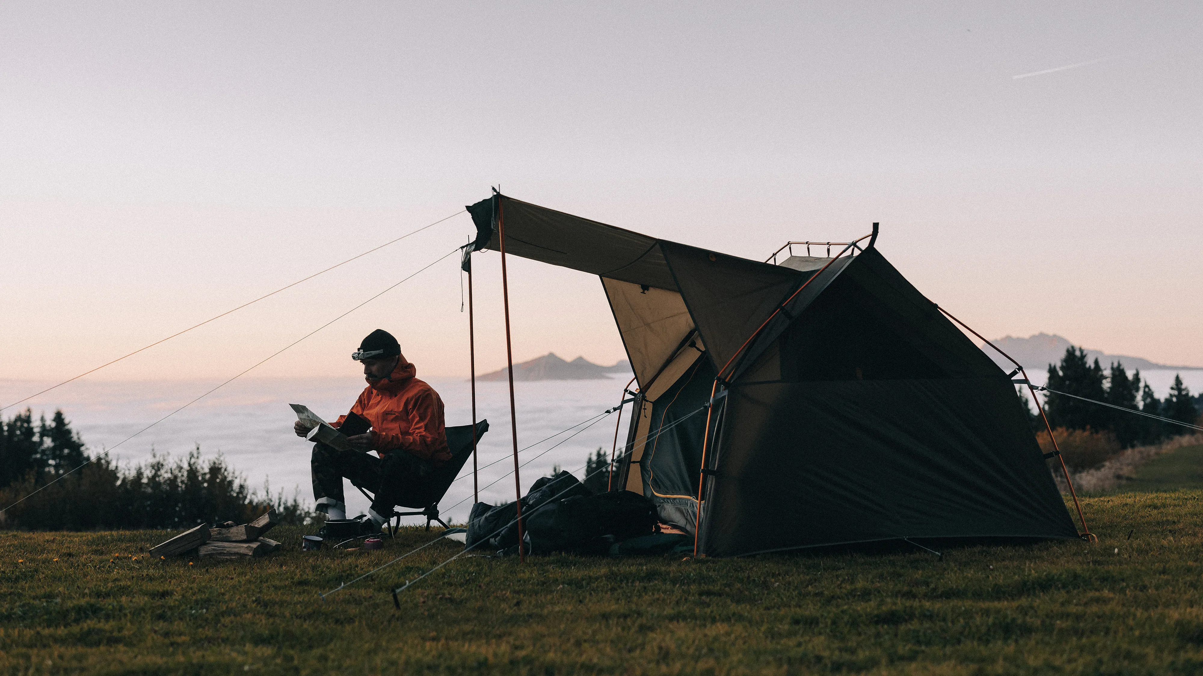 Man sitting outside a Kampa tent